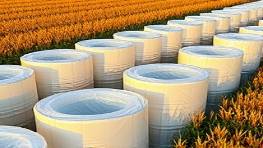 reliable polyethylene sheets, gently curved, photorealistic, agricultural field with crops and tools around, highly detailed, soft folds, 70mm lens, dark orange, clear morning light